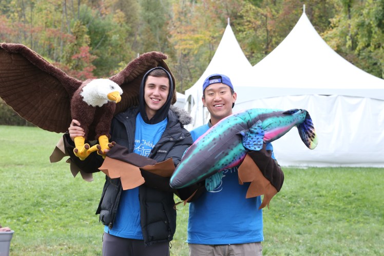 A couple of the high school student presenters having fun with activity props.