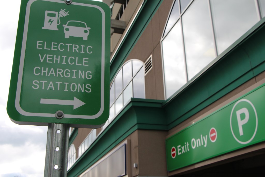 EV charging station sign at City of Burlington parking garage
