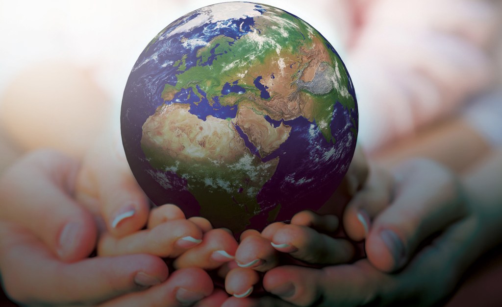 Hands holding earth