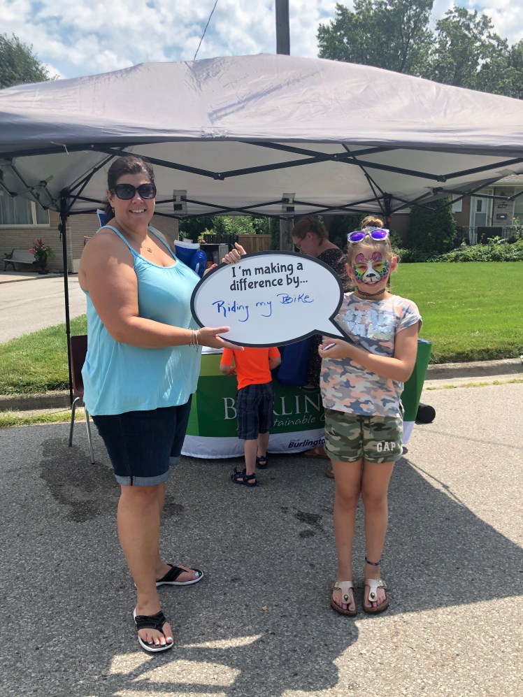 Parent and child making a commitment for the environment