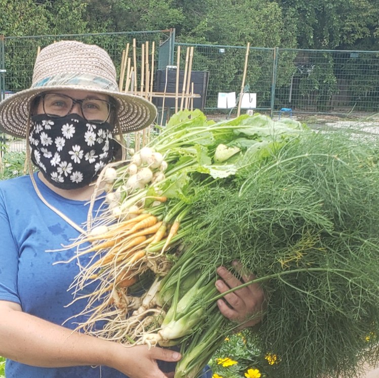 Alyson with fresh harvest from Open Doors community garden