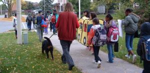 students and adults walking to school together